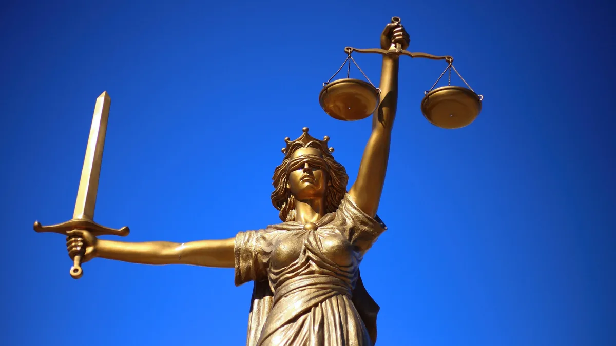 Lady Justice and scales representing borrower complaint redress under the RBI Ombudsman Scheme